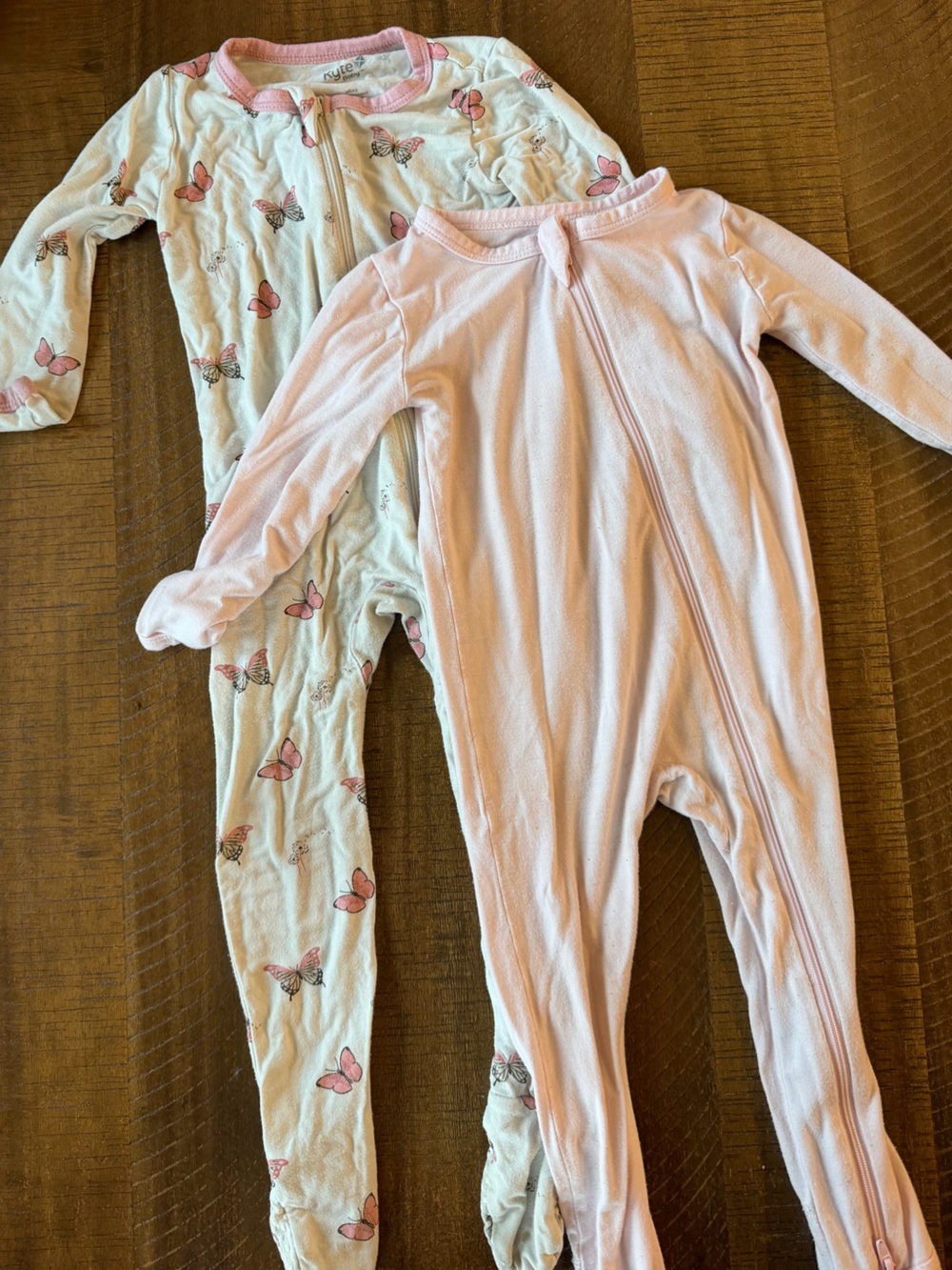 Bundle of 2 Kyte Baby Footed Onesies Sized 12-18M Pink and Butterfly